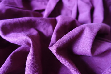 Pale violet linen fabric with folds and shadows
