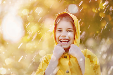 child under autumn rain