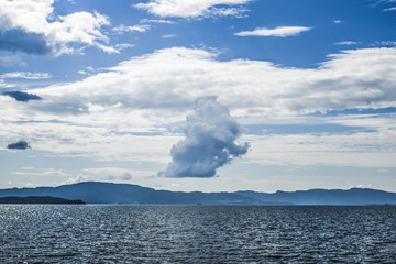 Fototapeta na wymiar Beautiful landscape on the north sea in norway with clouds on a sunny day