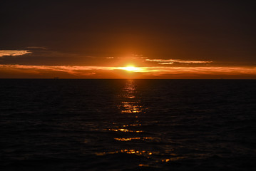 Beautiful red sunrise in the northern summer sea