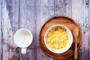 Time to breakfast with milk and corn flakes