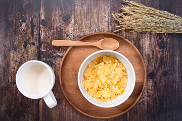 Time to breakfast with milk and corn flakes