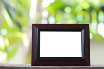 Modern Picture Frame placed on a wooden floor.