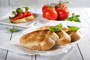 Toasted bread and tomato, mozzarella cheese, basil bruschetta 
