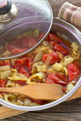 Cooked vegetable mix in pan on wooden table