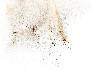 abstract brown powder splatted on white background,Freeze motion of color powder exploding.