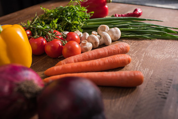 close-up shot of assorted fresh vegetables on rustic table
