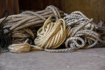 rope pattern formed by different colors of worn intertwined strings