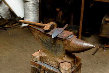 Forge, anvil, knife making.