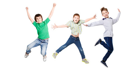 Fototapeta na wymiar Happy kids jumping at studio, copy space