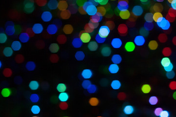 Abstract background of out of focus lights at night. Light hexagon.