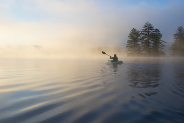 Kayaking at dawn. Grafton Pond, Enfield, New Hampshire, United States.