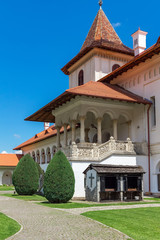 Obraz premium Exterior, facade of building Brancoveanu orthodox monastery with courtyard area in Sambata de Sus village, Romania