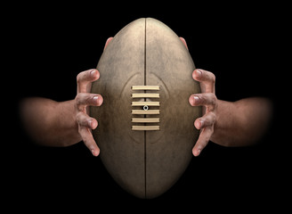 Hands Gripping Rugby Ball