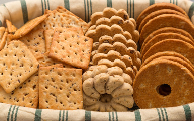 Some sweet and salty cookies on a wicker tray.