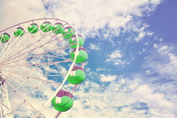 Retro toned picture of a Ferris wheel, space for text.