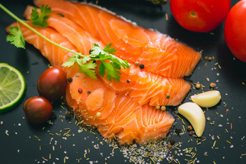 Delicious portion of fresh salmon fillet with salt and pepper