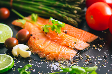 Delicious portion of fresh salmon fillet with salt and pepper