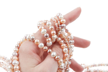 Hand holding pearls