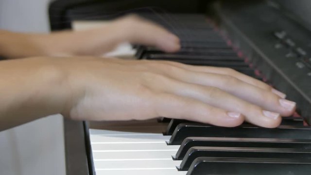 The girl plays the piano