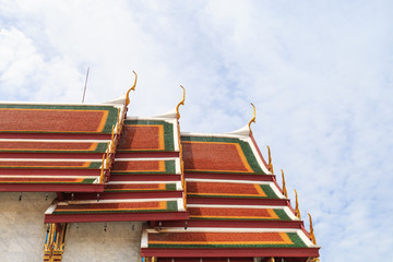 A golden and green Thai Church roof