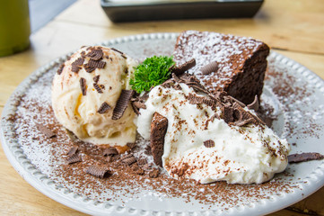 ice cream Vanilla chocolate pie whippin creamy tasty dessert on wood table in cafe ready to eat in restaurant.