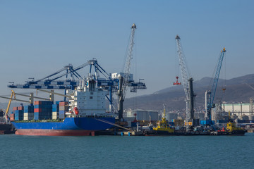 International sea port of Novorossiysk. Cranes loading cargo ship