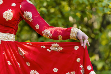 Indian women dressed in traditional sari at a park in India