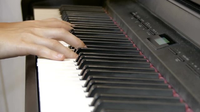 The girl plays the piano