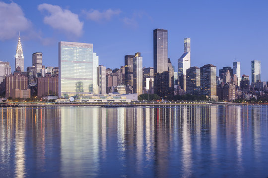 USA, New York, New York City, Long Island City, Mid town Manhattan skyline with UN building, dawn