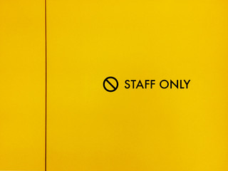 closeup of staff only sign on a door