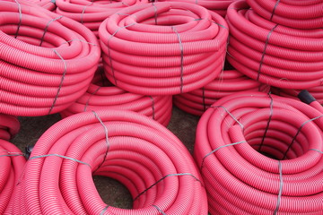 Red corrugated plastic pipes used for underground electrical lines