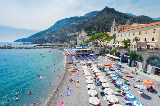 Amalfi Town And Summer Beach With Umbrellas , Italy