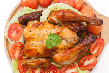 close up roast chicken on wooden plate  isolated on white