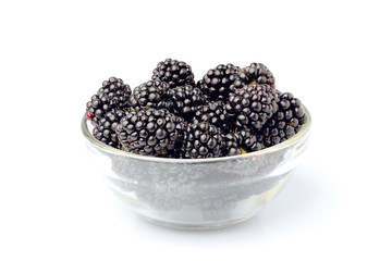 Fresh blackberries in a glass bowl.