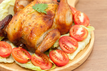  roast chicken on wooden plate