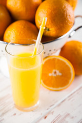 Fresh oranges in a colander