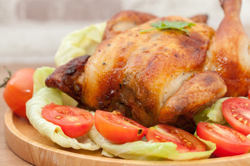  roast chicken on wooden plate