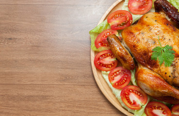  roast chicken on wooden plate