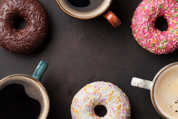 Coffee cups and colorful donuts