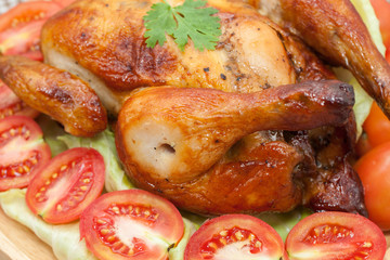  roast chicken on wooden plate