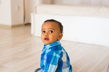 Portrait of mixed race kid at home