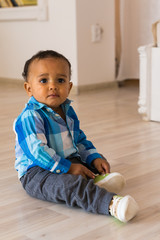 Naklejka premium African American baby boy indoors