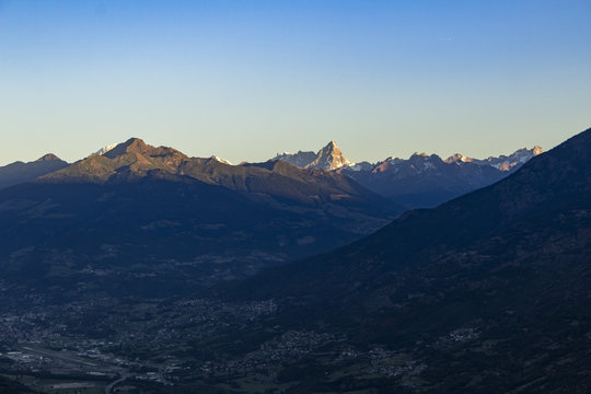 Sunrise on the tops of the mountains above Aosta Valley