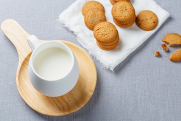 cookies and milk on gray cloth background