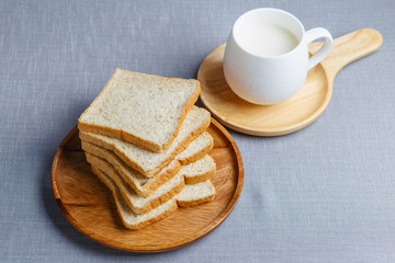 Whole Wheat Bread and milk on gray cloth