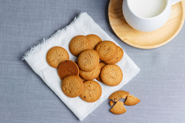 cookies and milk on gray cloth background