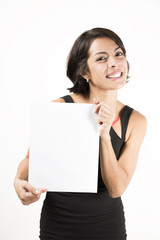 Naklejka premium Beautiful young woman holding a blank sheet of paper