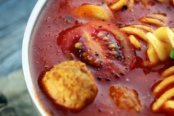 Tomato soup with meatballs in a bowl. Italian minestrone soup