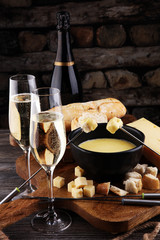 Gourmet Swiss fondue dinner on a winter evening with assorted ch